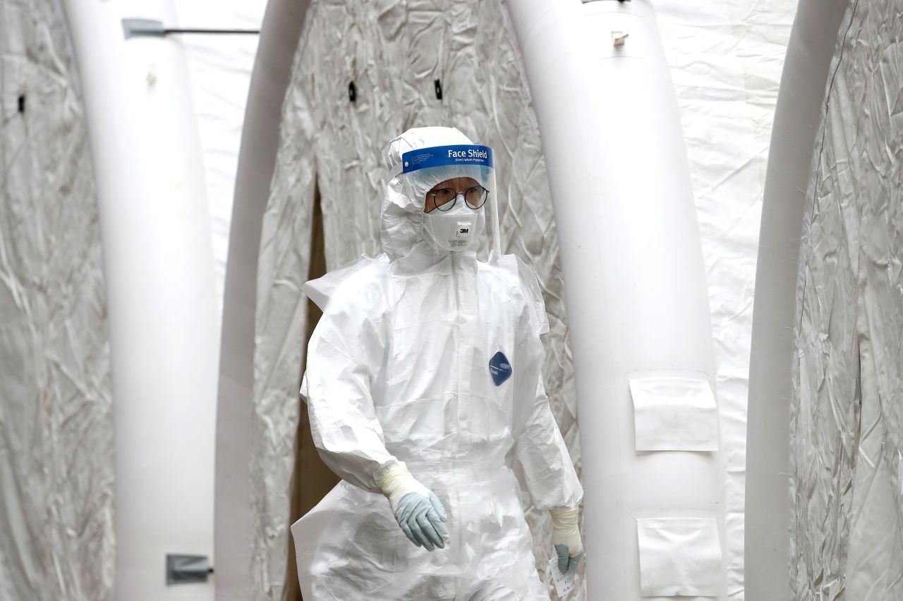 A medical worker at a preliminary testing facility at the National Medical Center where patients suspected of contracting coronavirus are assessed in Seoul.