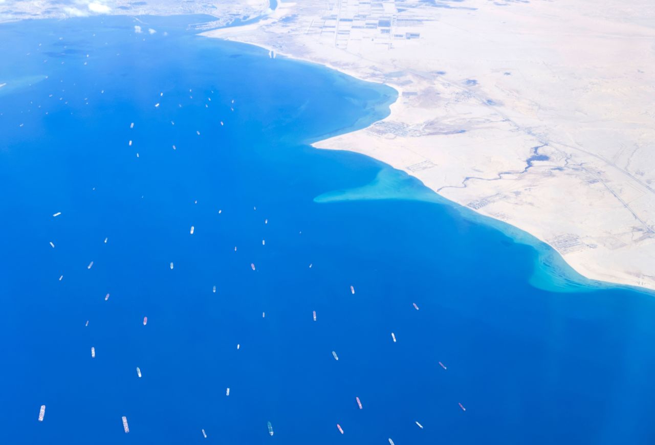 Stranded ships wait in queue in the Gulf of Suez to cross the Suez Canal at its southern entrance near the Red Sea port city of Suez on March 27, as the waterway remains blocked by the Panama-flagged container ship "MV Ever Given".