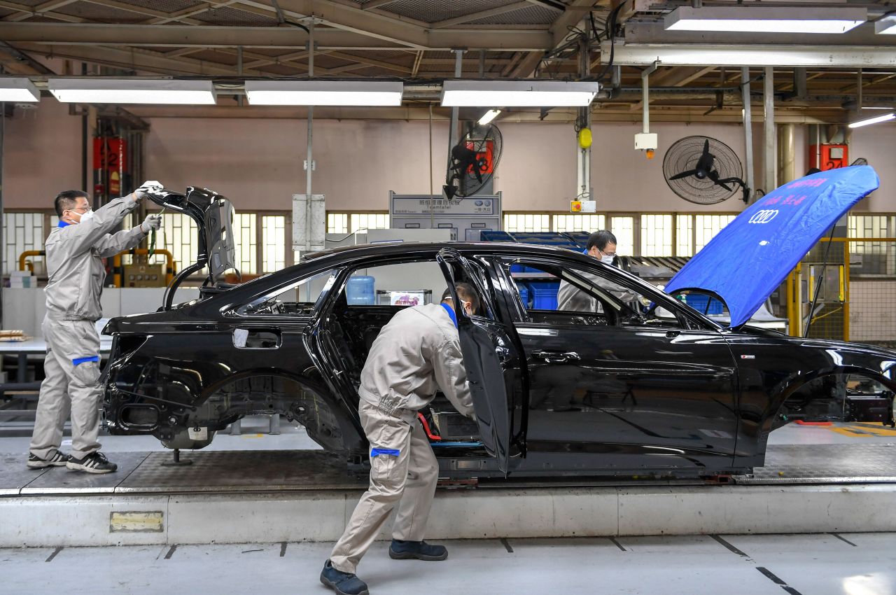 Workers assemble cars at a Volkswagen Automobile workshop in Changchun on February 17.