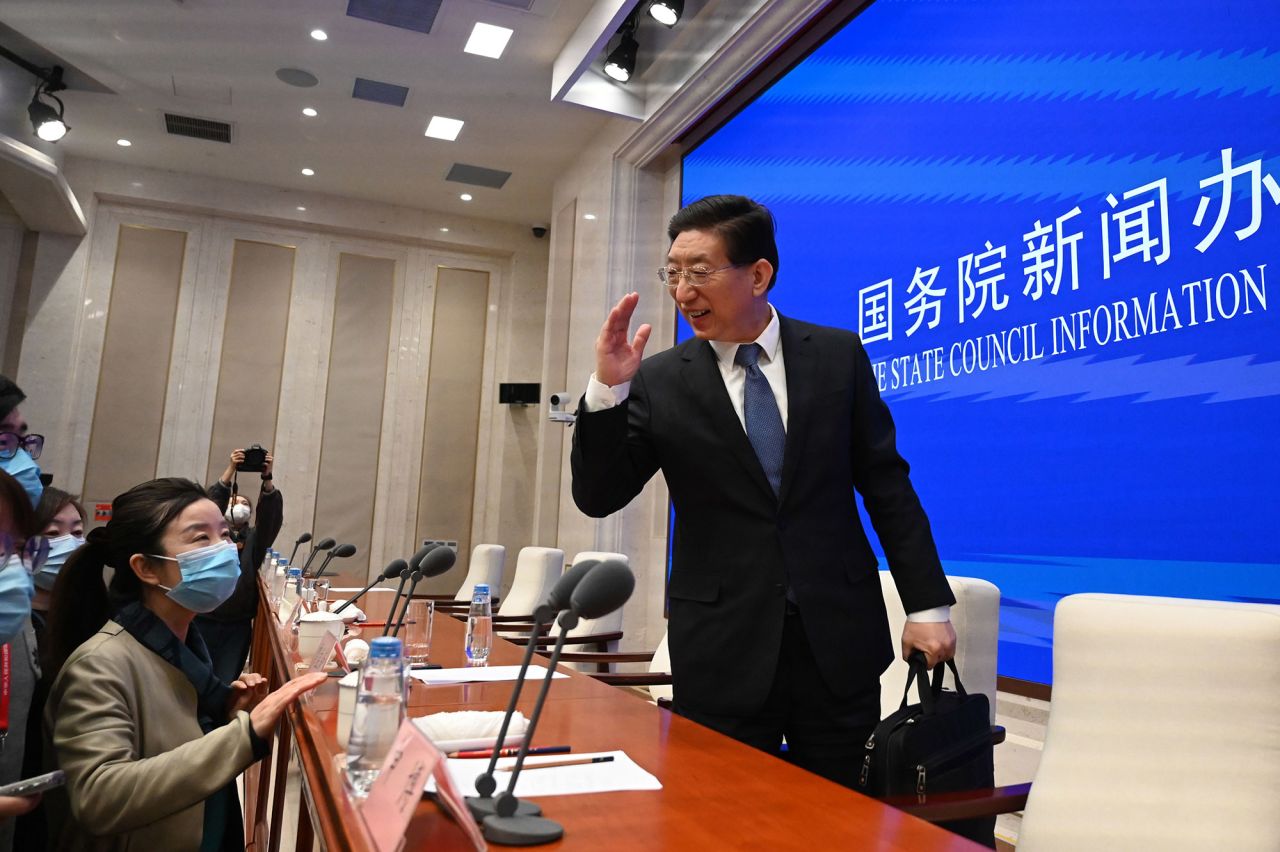 Zeng Yixin, a vice-minister of China's National Health Commission, leaves following a news conference in Beijing on Friday.