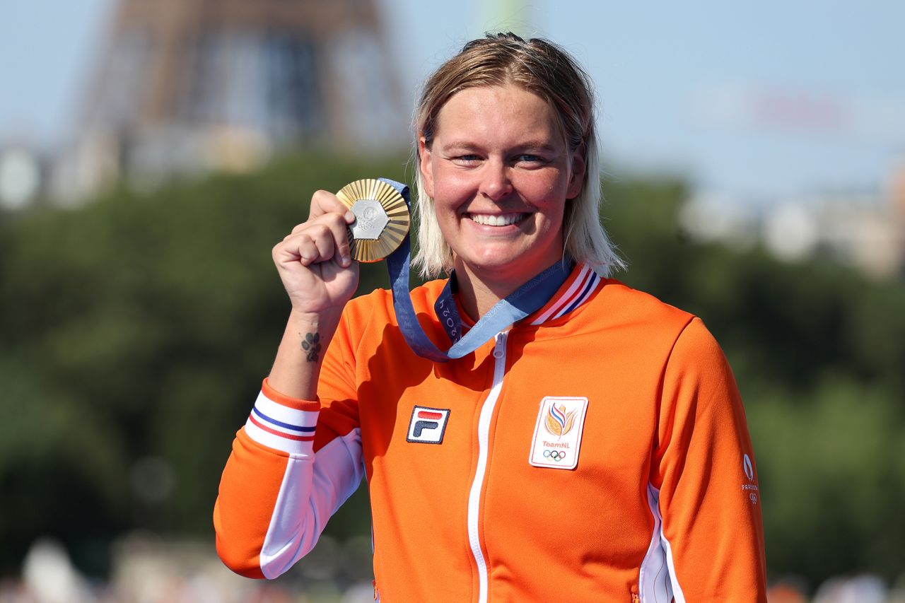 Gold Medalist Sharon van Rouwendaal of Team Netherlands poses following the Marathon Swimming medal ceremony after the marathon swimming women's 10k at Pont Alexandre III on August 8.