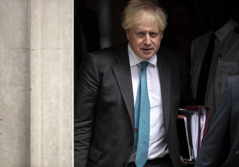 British Prime Minister Boris Johnson leaves Downing Street in London to attend the weekly Prime Ministers Questions session on September 16.
