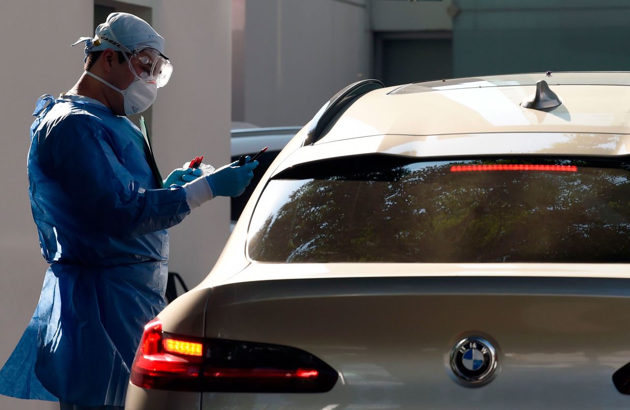 A doctor gives coronavirus administers at the Biomedica Lab in Mexico City on March 30.