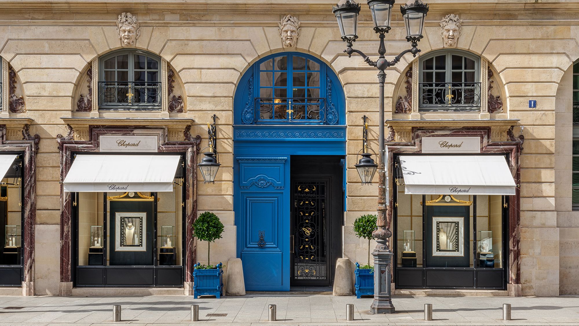 A pair of blue doors and a wrought iron gate with a cursive "C" are the only identifiers of Chopard's discreet new hotel, flanked by it's jewelry store in Paris.