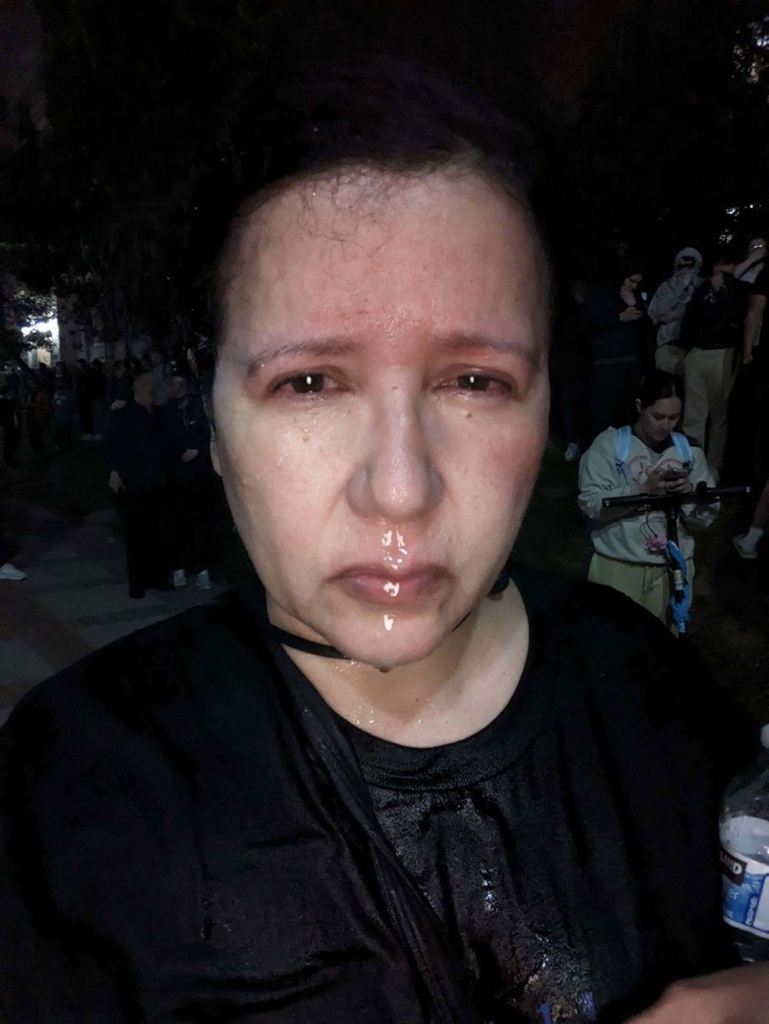 Dolores Quintana pictured shortly after being pepper-sprayed while covering the protests at UCLA in early May.