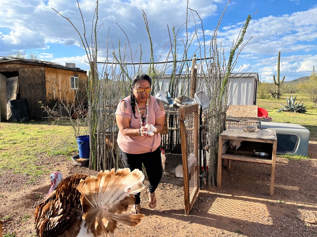Faith Ramon handles eggs at her home near Nogales, Arizona.