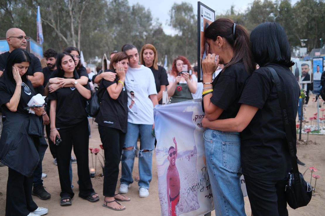 The family of Amit Itzhak David gathers at his memorial at the site of the attack on the Nova Music Festival.