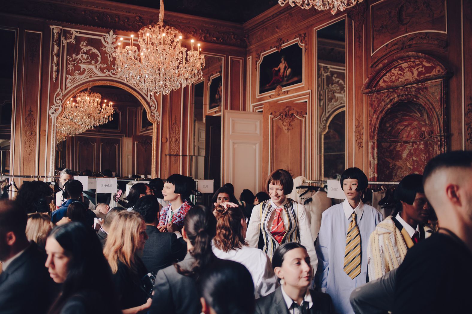 Models getting ready backstage at Thom Browne.