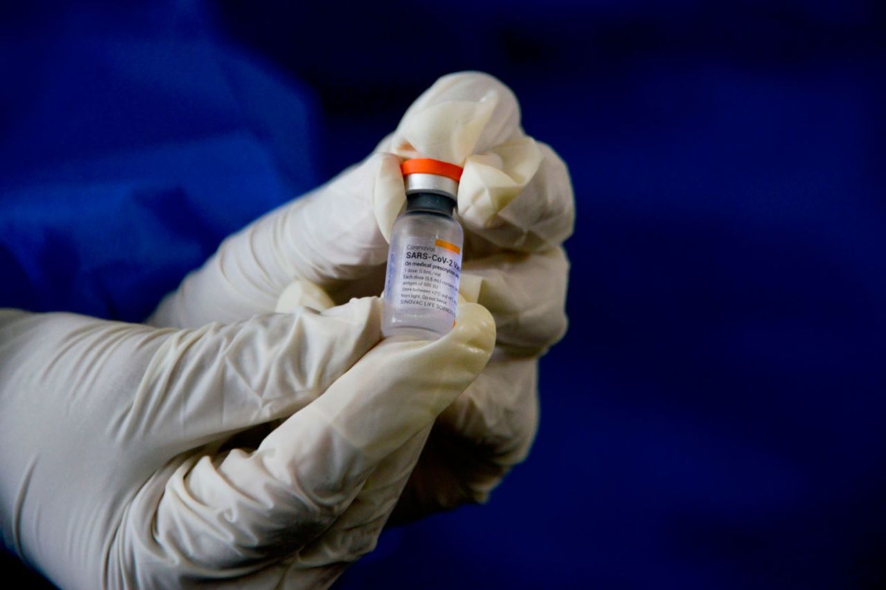 A health worker shows the Sinovac vaccine at a community health centre in Lambaro, Indonesia on January 18.