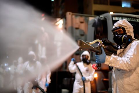 Soldiers spray disinfectant at the Municipal Market in the Belo Horizonte, Brazil, on August 18.