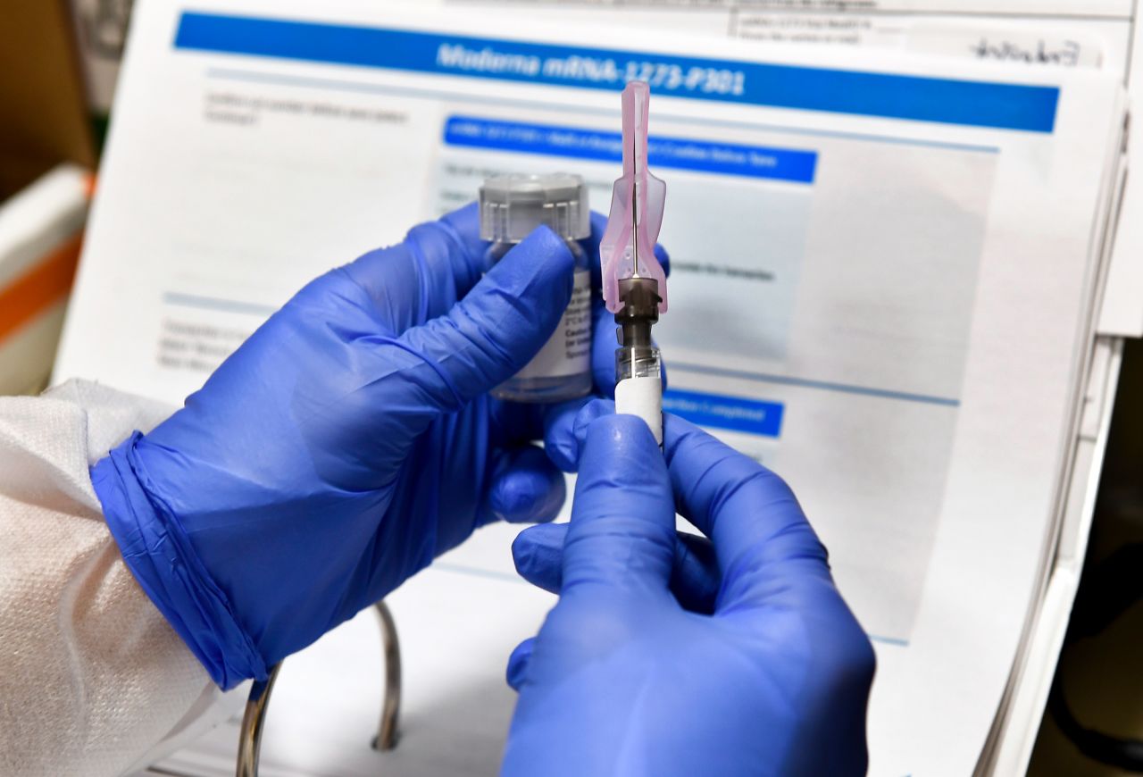 Nurse Kathe Olmstead prepares a shot on July 27 that is part of a possible COVID-19 vaccine, developed by the National Institutes of Health and Moderna Inc., in Binghamton, New York.