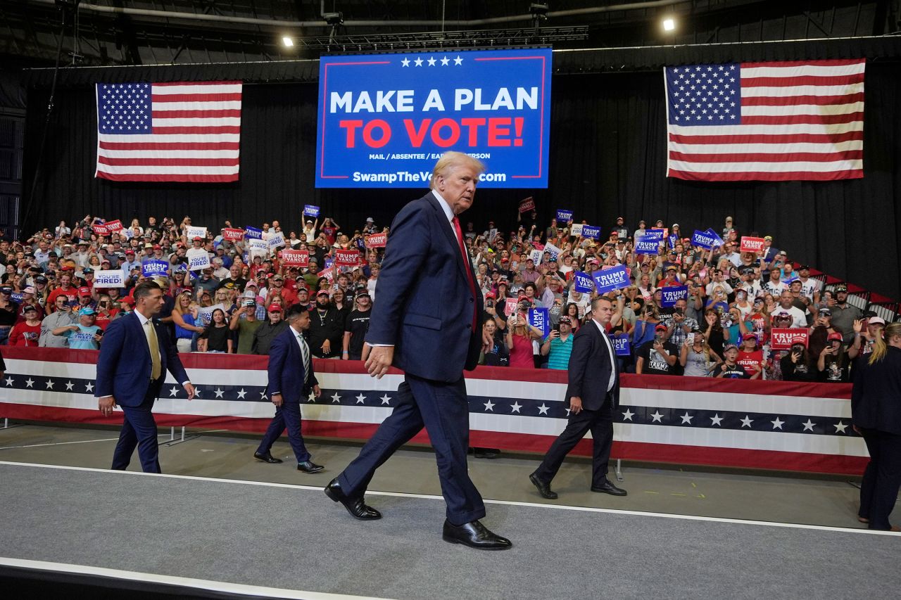 Former President Donald Trump walks after a campaign rally in Bozeman, Montana, on August 9.