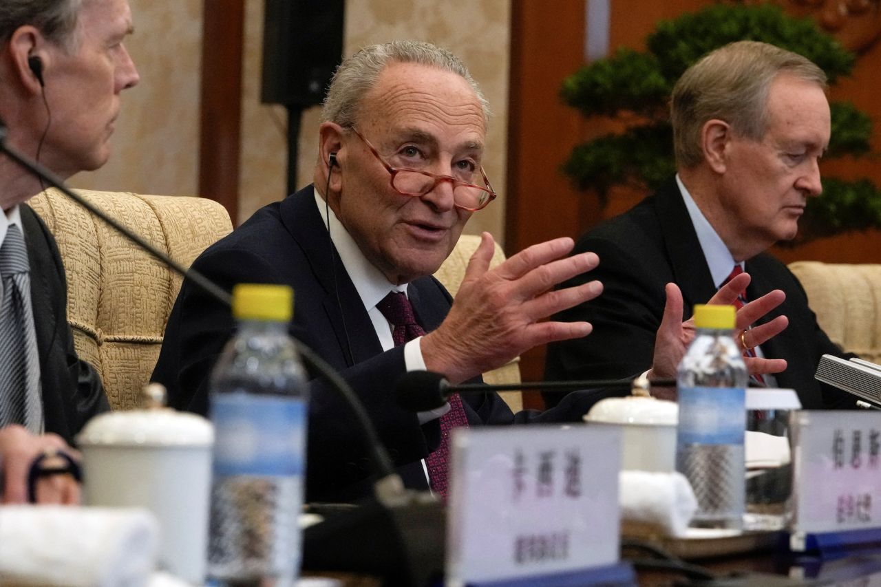 Senate Majority Leader Chuck Schumer speaks during a bilateral meeting with Chinese Foreign Minister Wang Yi in Beijing on Monday.