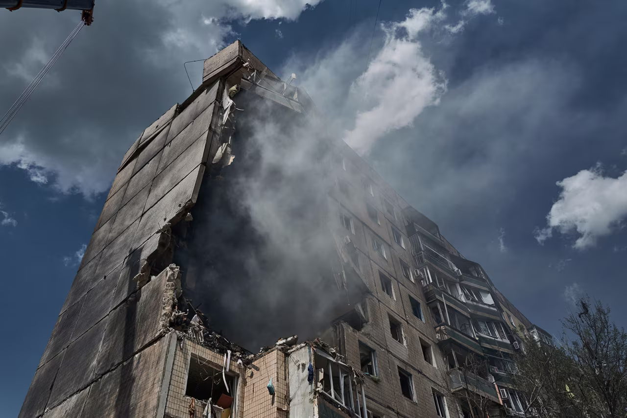 Emergency services work at an apartment building after a missile strike in Kryvyi Rih, Ukraine, on Monday, July 31. 