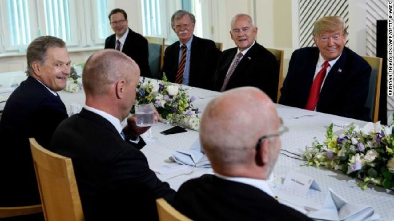 Finland's President Sauli Niinist? (far left) and Trump (far right) sit down for breakfast along with other officials ahead of the much-anticipated summit with Putin. 