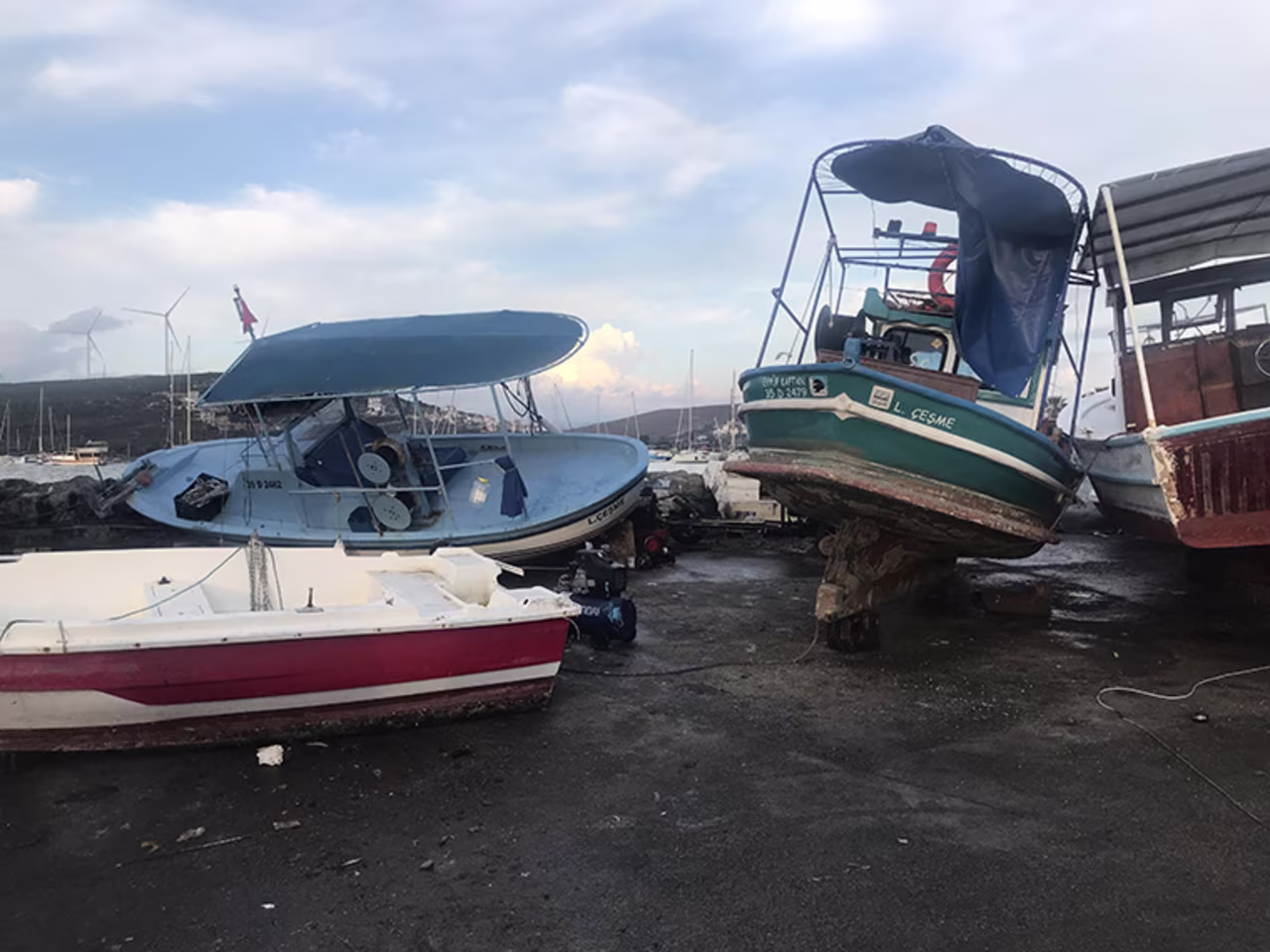 Anchored boats are seen damaged after a magnitude 7.0 quake shook Turkey's Seferihisar coastline in Izmir, Aegean Sea in Turkey, on October 30, 2020. 