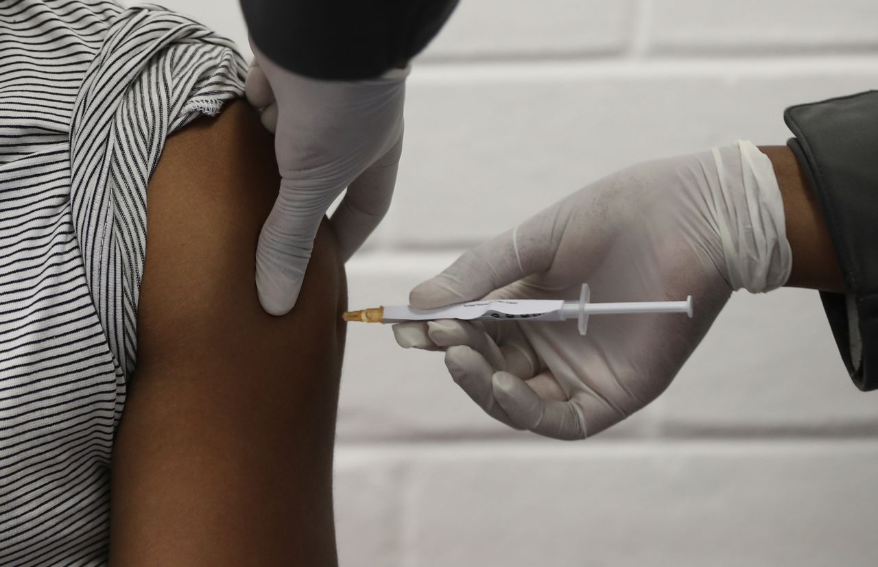 A medical worker injects a vaccine trialist with the clinical trial for a potential vaccine against the COVID-19 coronavirus at the Baragwanath hospital in Soweto, South Africa, on June 24 ,2020.?