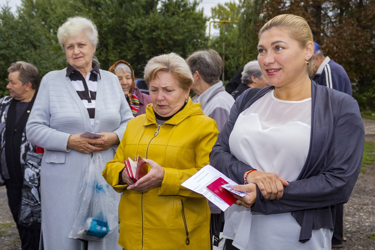 People gather to attend voting in a referendum in front of a mobile polling station in Krasny Yar village outside Luhansk, eastern Ukraine, on September 23.