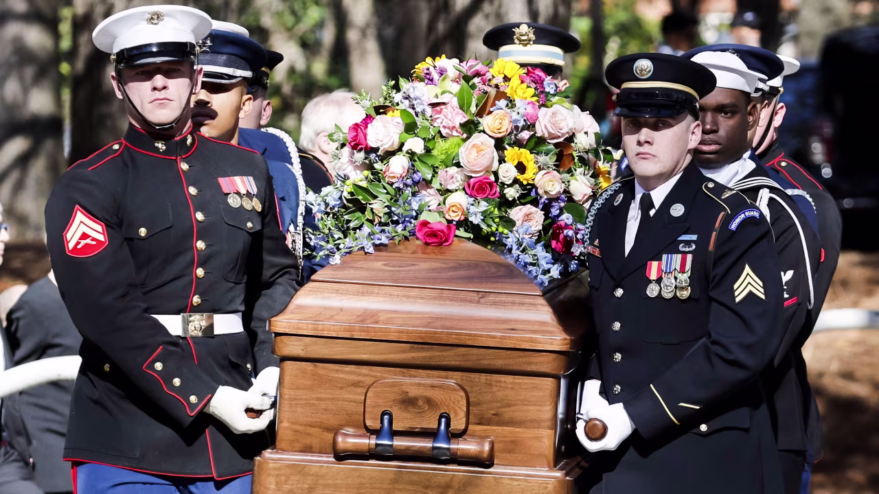 A military honor guard carries the casket of former first lady Rosalynn Carter from the Jimmy Carter Presidential Library and Museum in Atlanta, Georgia, on November 28, en route for an afternoon tribute service at Glenn Memorial Church at Emory University.