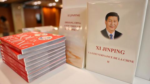 Books about Xi Jinping's governance of China are featured at a closed-loop hotel in Beijing, housing journalists and other guests during the Party Congress.
