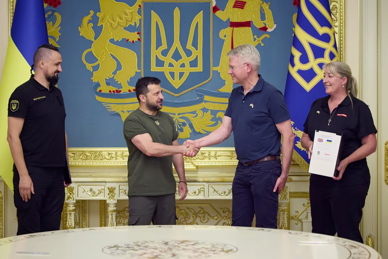 President of Ukraine Volodymyr Zelensky, center left, meets with representatives of BAE Systems CEO Charles Woodburn, center right, in Kyiv, Ukraine on August 31.