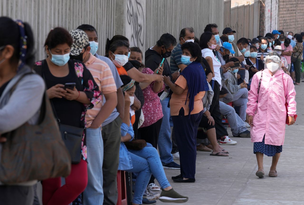 People stand in line to wait for PCR tests in Lima, Peru, on Wednesday, January 5.
