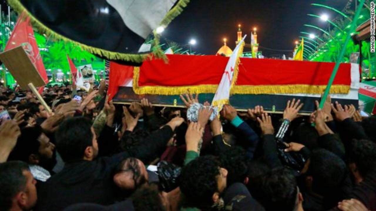 Mourners carry the coffins of Iran's top general Qasem Soleimani and Abu Mahdi al-Muhandis, deputy commander of Iran-backed militias in Iraq known as the Popular Mobilization Forces, during their funeral in Karbala, Iraq, Saturday.