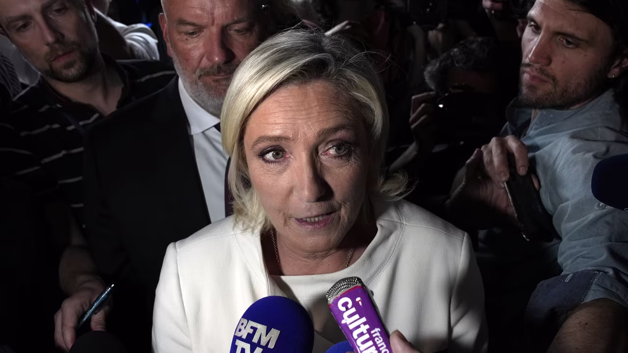 Far-right National Rally party leader Marine Le Pen answers reporters after the second round of the legislative election on July 7 at the party election night headquarters in Paris, France.