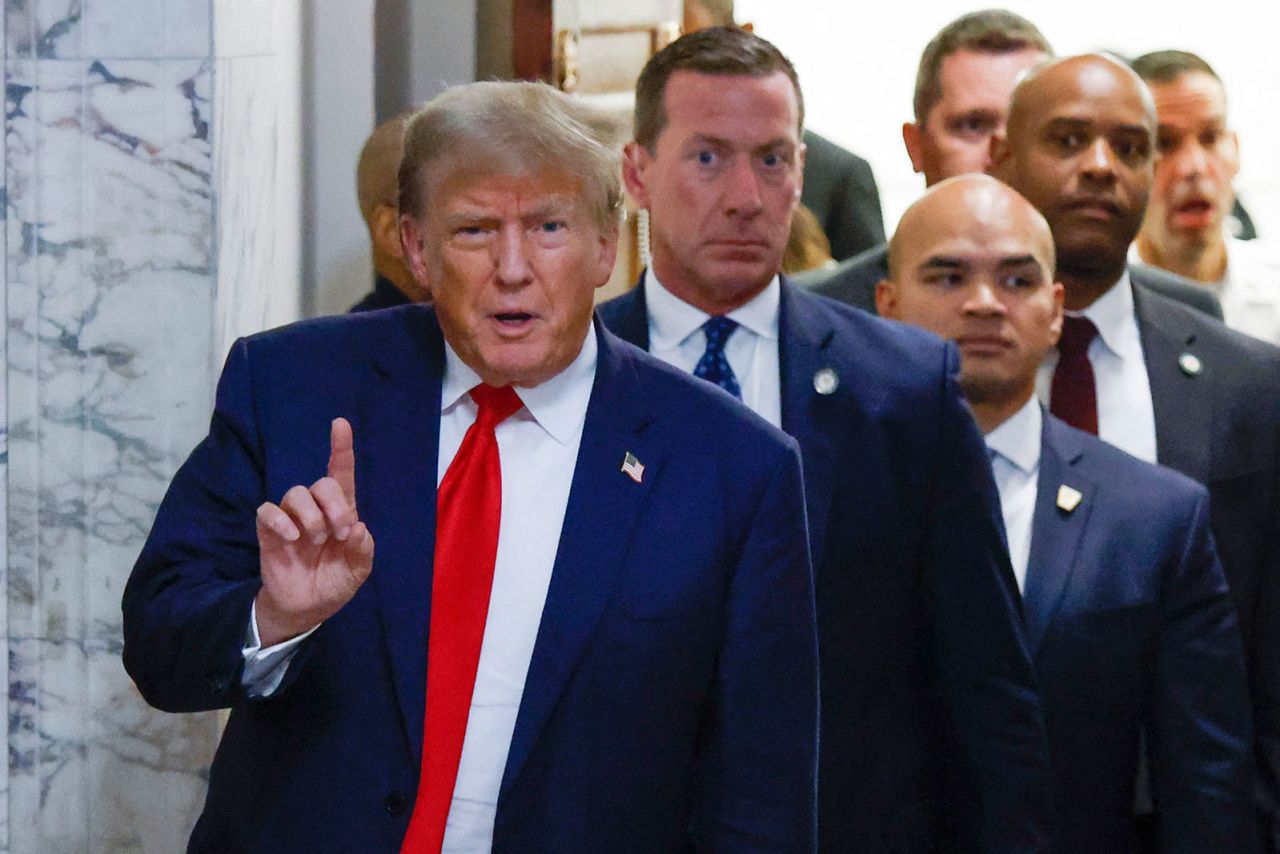 Trump speaks as he leaves court on Tuesday, October 3.