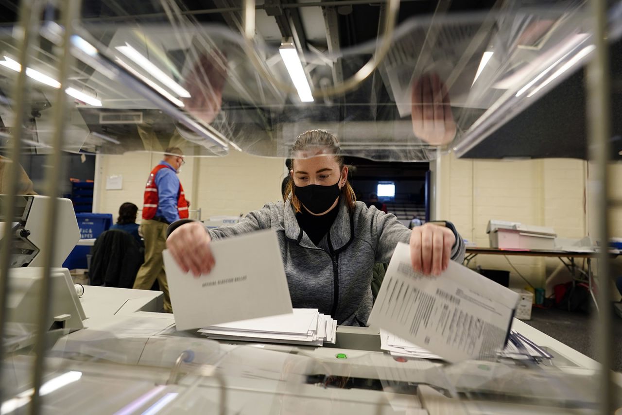 Chester County, Pennsylvania election worker Kristina Sladek opens mail-in and absentee ballots for the 2020 General Election in the United States at West Chester University on Tuesday.