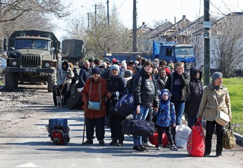 Evacuees wait to board a bus to leave Mariupol, Ukraine, on Wednesday, April 20. 