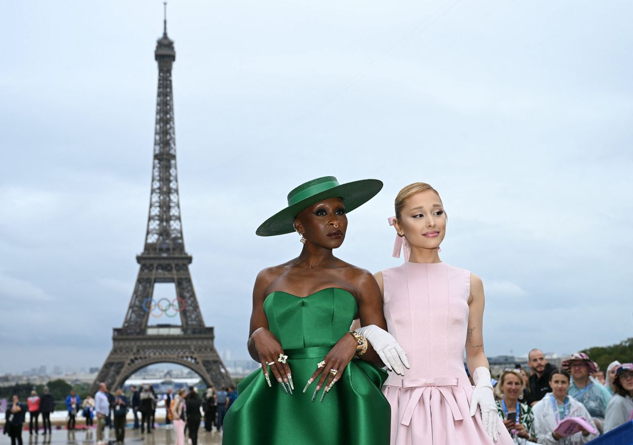 British actress and singer Cynthia Erivo (L) and US singer Ariana Grande (R) arrive ahead of the opening ceremony in Paris today.