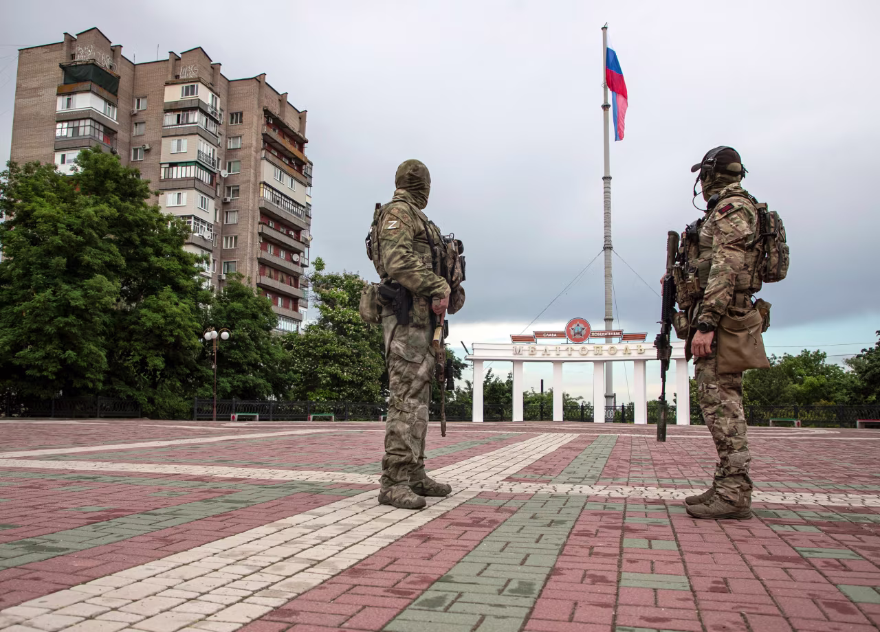 Russian servicemen keep watch in the main square of Melitopol, Zaporizhia region, Ukraine, on June 14.