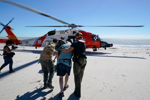 Residents of Sanibel Island are moved to a waiting US Coast Guard helicopter on Friday, September 30. 