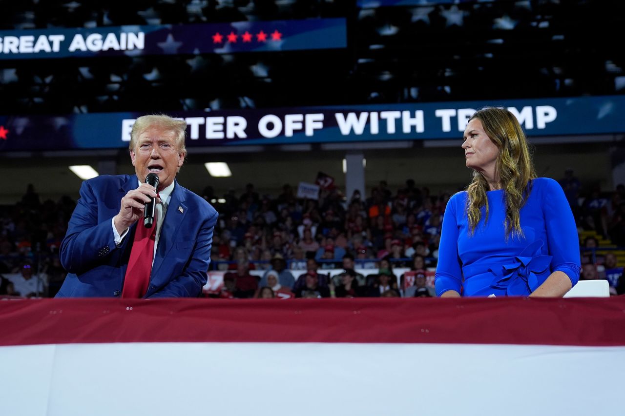 Arkansas Gov. Sarah Huckabee Sanders, right, on stage with Republican presidential candidate former President Donald Trump, during a town hall event in Flint, Michigan on September 17. 