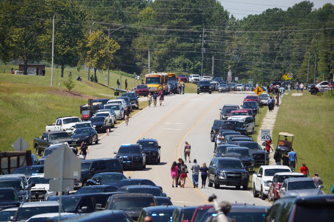 Cars line the road as parents arrive to meet students after a shooting at Apalachee High School on September 4, in Winder, Georgia.