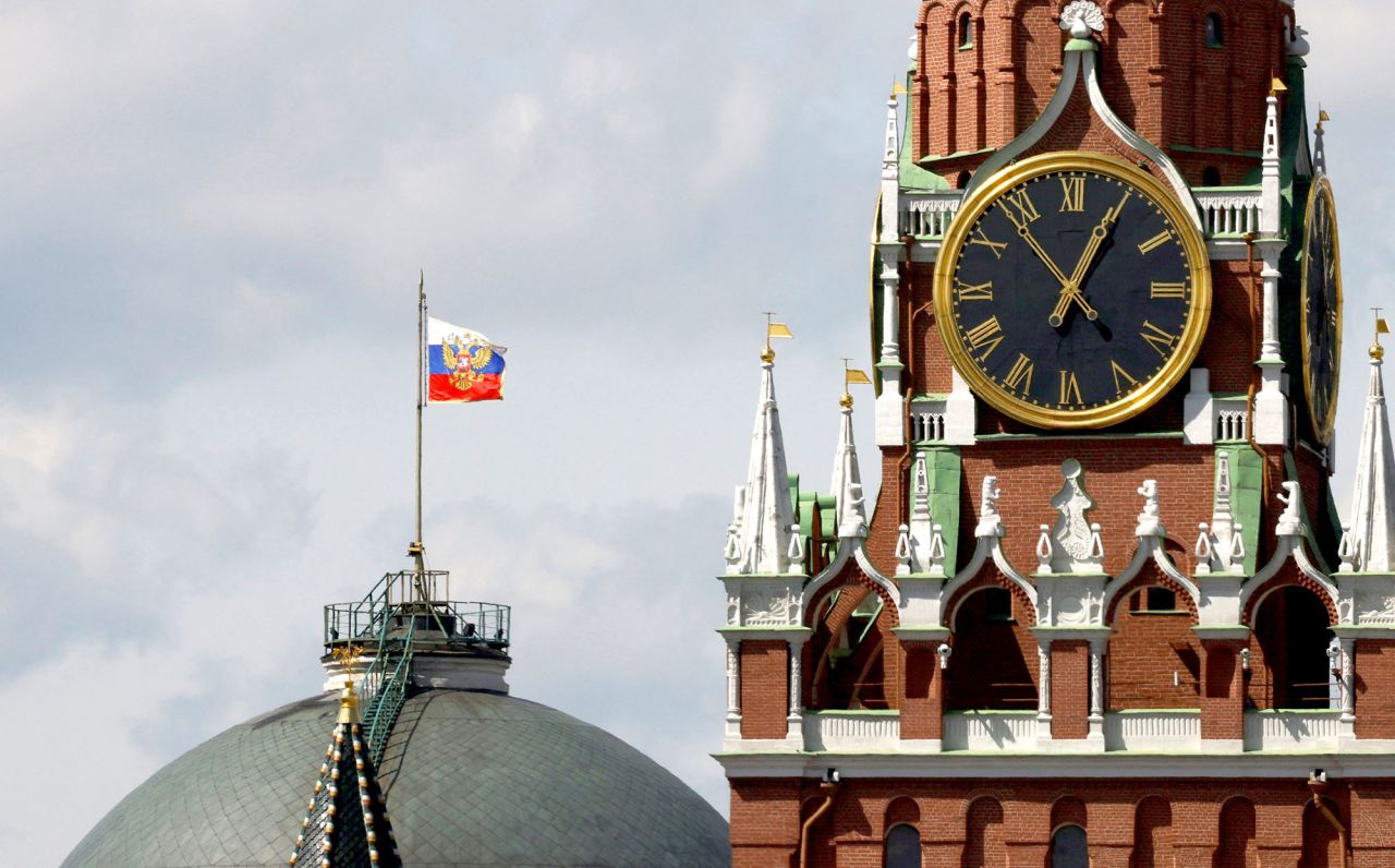 The Russian flag flies on the dome of the Kremlin Senate building behind Spasskaya Tower, while the roof shows what appears to be marks from the recent drone incident, in central Moscow, Russia, on May 4.