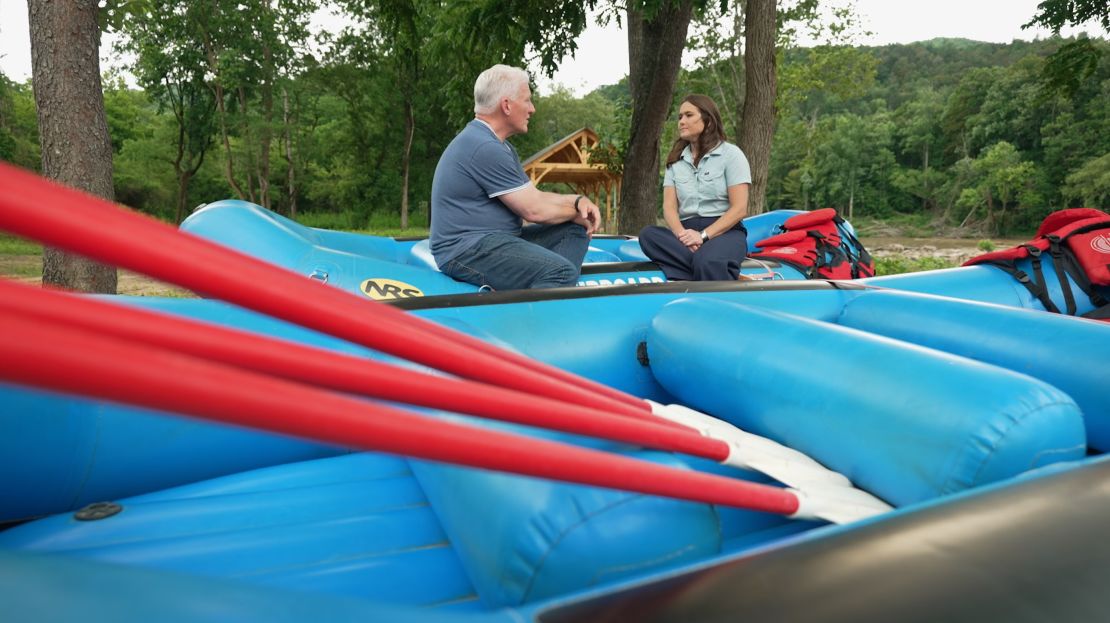 Korey Hampton talks to John King on the banks of the French Broad River in Marshall, North Carolina.