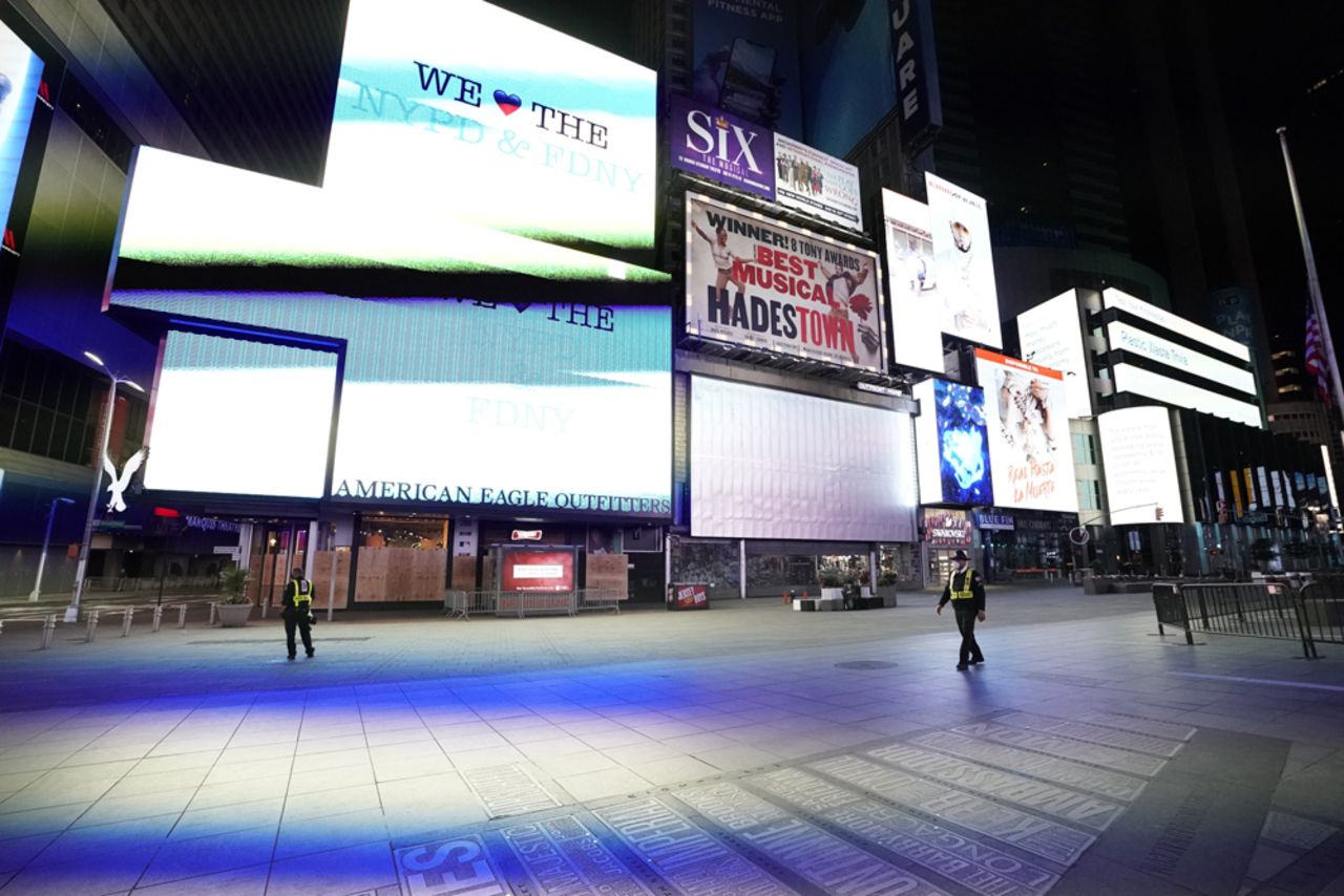 Security guards stand in a closed off Times Square shortly before the 11 p.m. curfew went into effect June 1.