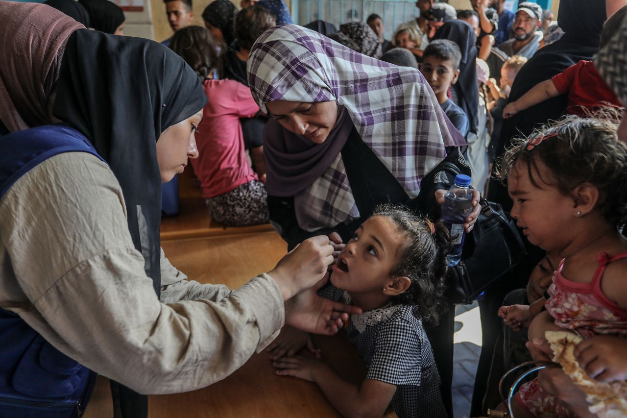 A child is vaccinated within the polio vaccination campaign covering more than 640,000 children under the age of 10, in Deir al Balah, Gaza on September 1, 2024.