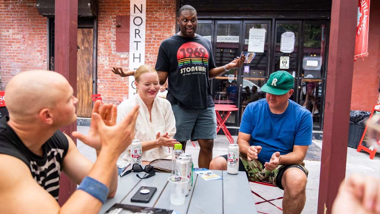 Rep. Mondaire Jones, center, campaigns in Brooklyn, New York, on August 21.