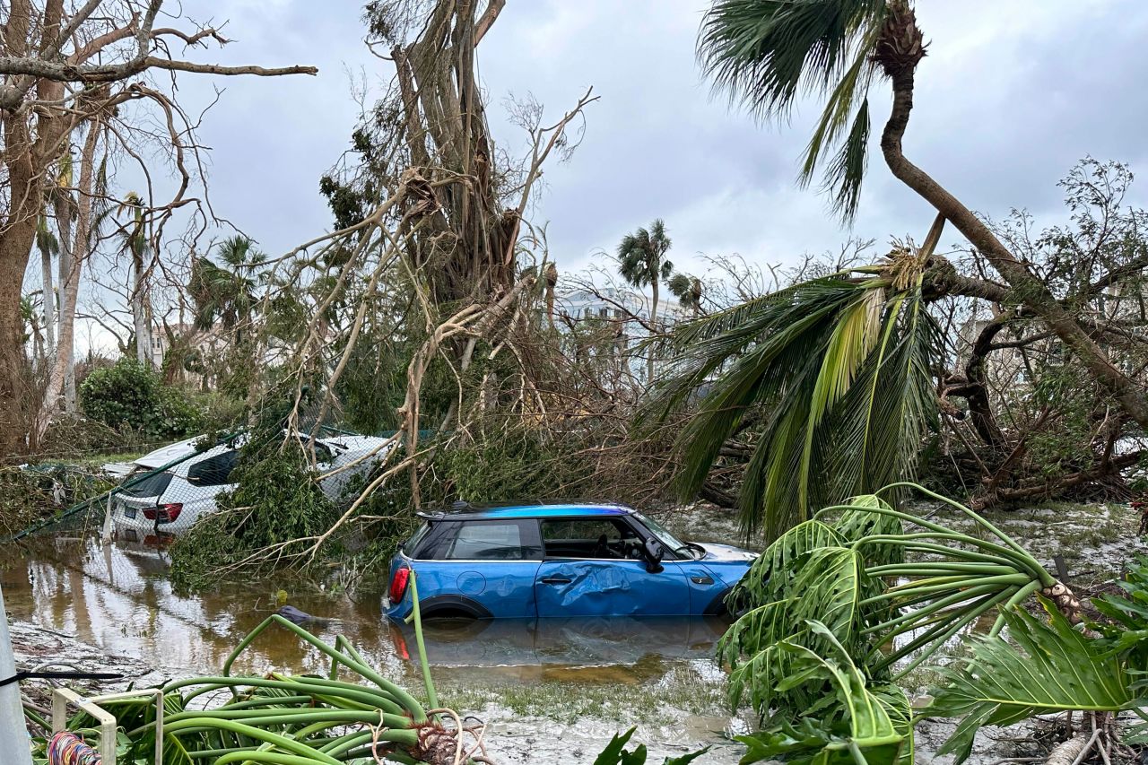 In this undated image taken from video, damaged vehicles are seen in floodwaters on Sanibel Island after Hurricane Ian struck.