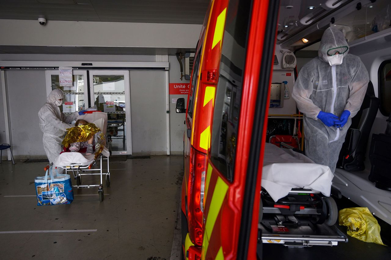 Firefighters bring a suspected coronavirus patient to a hospital in Marseille, France, on April 15.