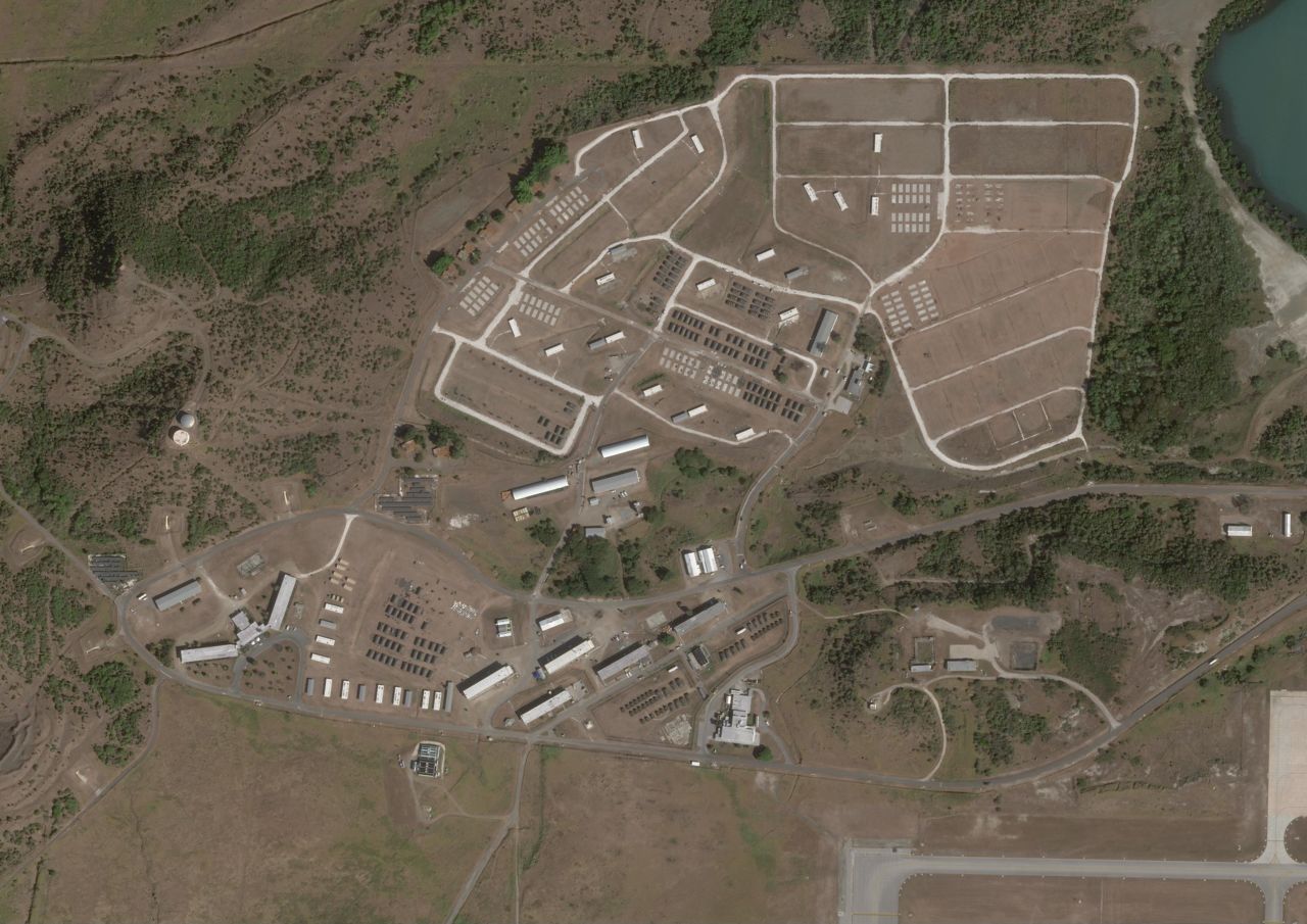 This satellite image taken February 7 shows new arrays of tents near an airstrip at the western edge of the base at Guantanamo Bay in Cuba.