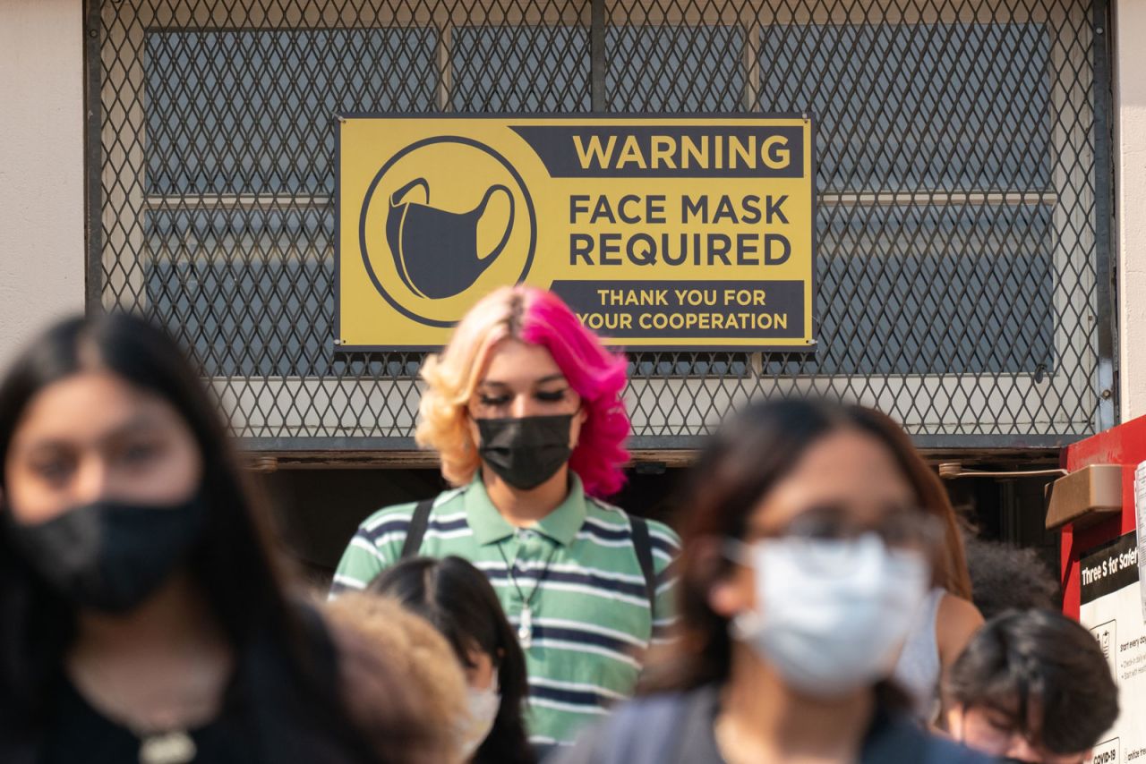 Students exit Hollywood High School after the first day of school in Los Angeles, California on Aug. 16.