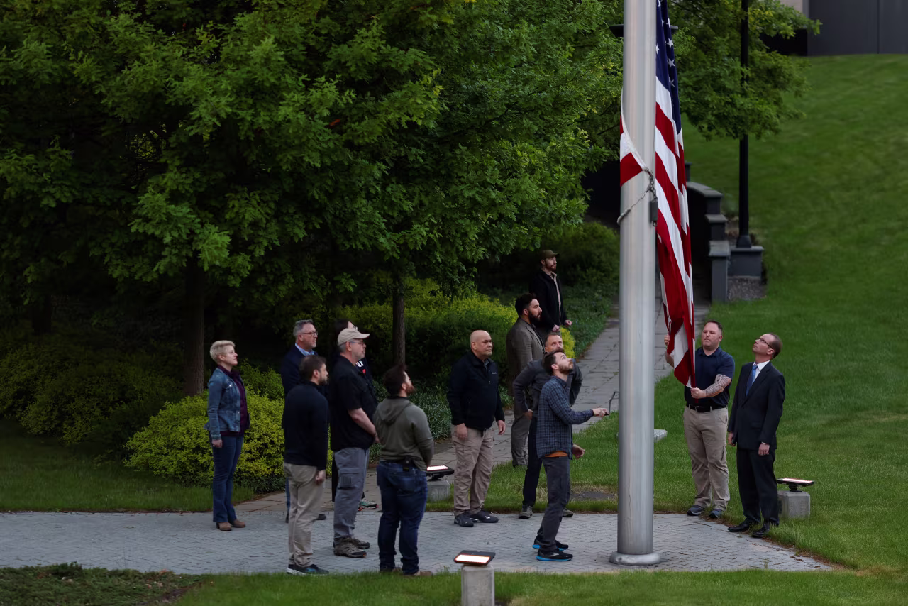 The US flag is raised at the United States embassy in Kyiv for the first time since American diplomats returned embassy on Wednesday.