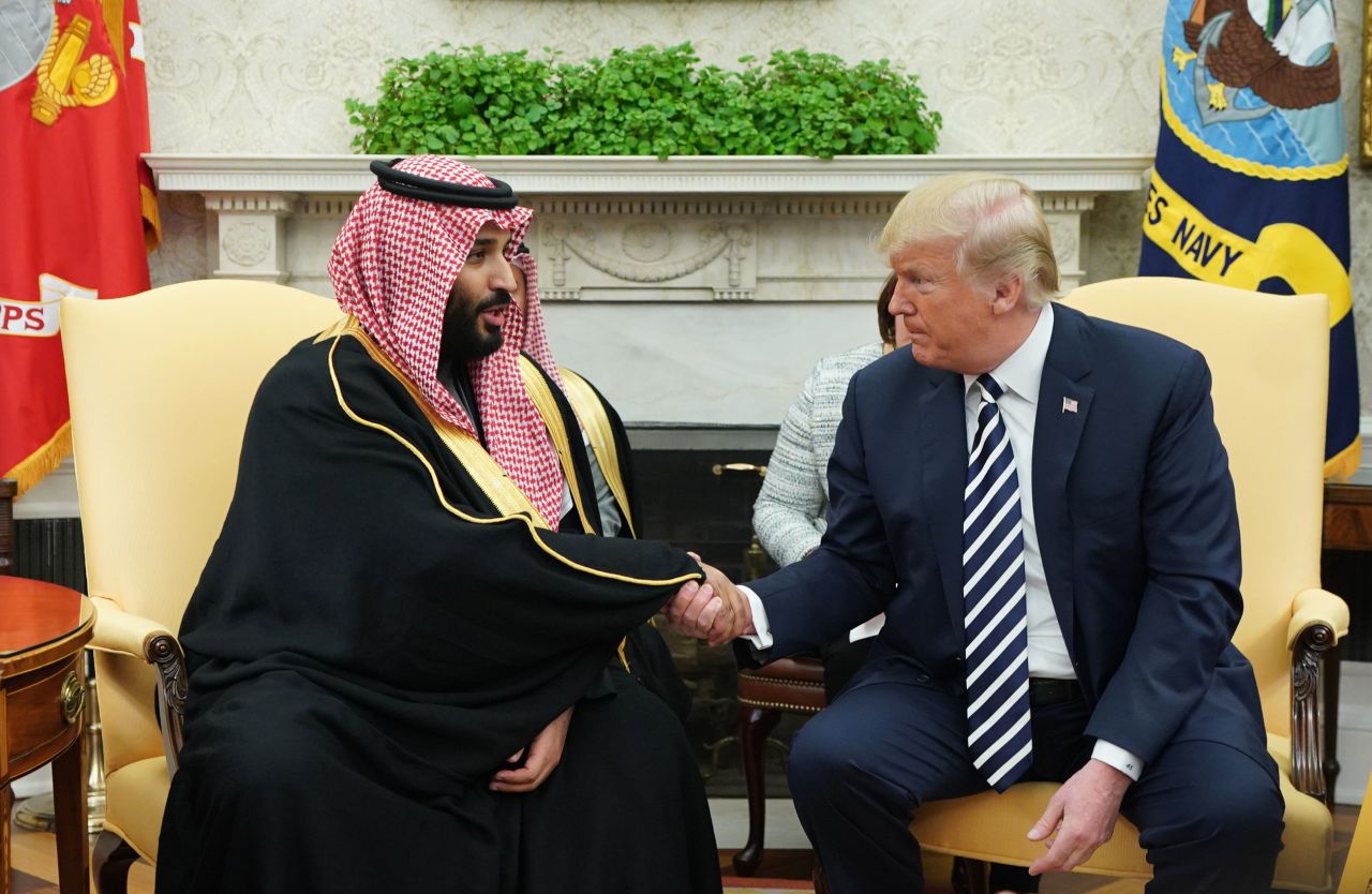 Trump (R) shakes hands with Saudi Arabia's Crown Prince Mohammed bin Salman in the Oval Office of the White House on March 20.