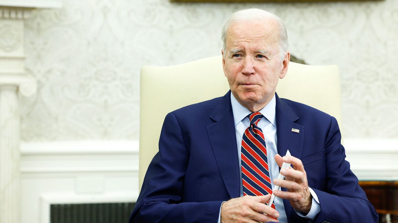 President Joe Biden speaks to reporter\ in the Oval Office on Friday, May 12.