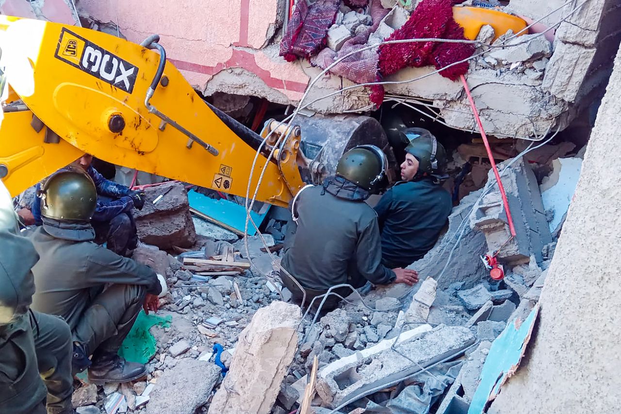 Rescue workers search for survivors in a collapsed house in Al Haouz province, Morocco, on September 9. 