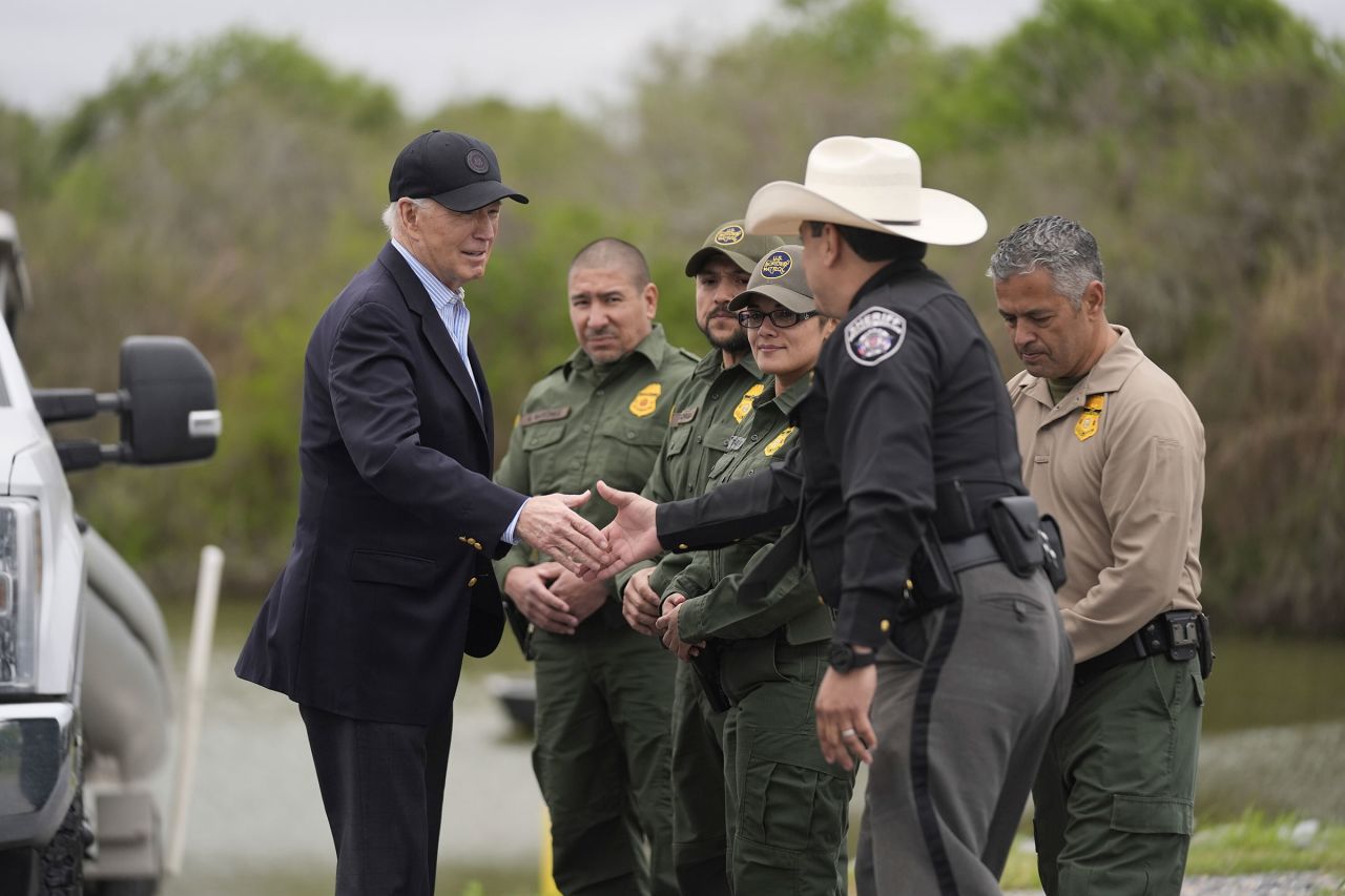 President Joe Biden talks with the US Border Patrol and local officials, as he looks over the southern border, on Thursday, February 29, in Brownsville, Texas along the Rio Grande.